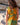 Vestido Prana maxi seda sari reciclado verde e amarelo padrão floral fenda lateral borlas Raja Pura - vista retrato costas